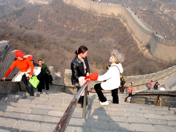 Artiste sur la muraille de Chine